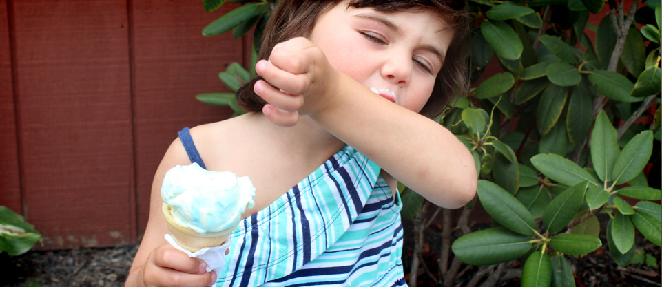 Girl eating ice-cream from store